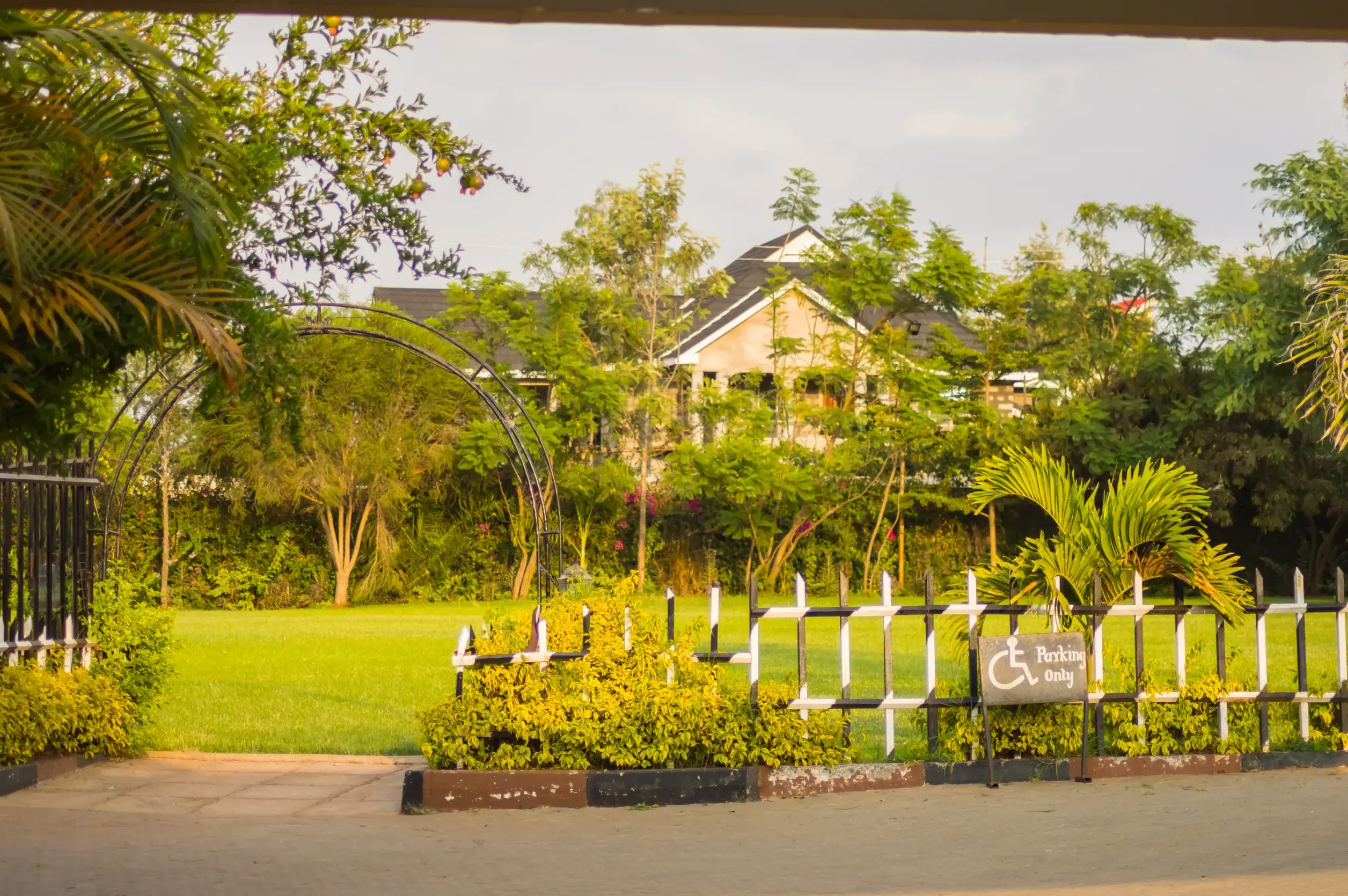 entrance to a flower park with a barrier and an ark in the city of nairobi