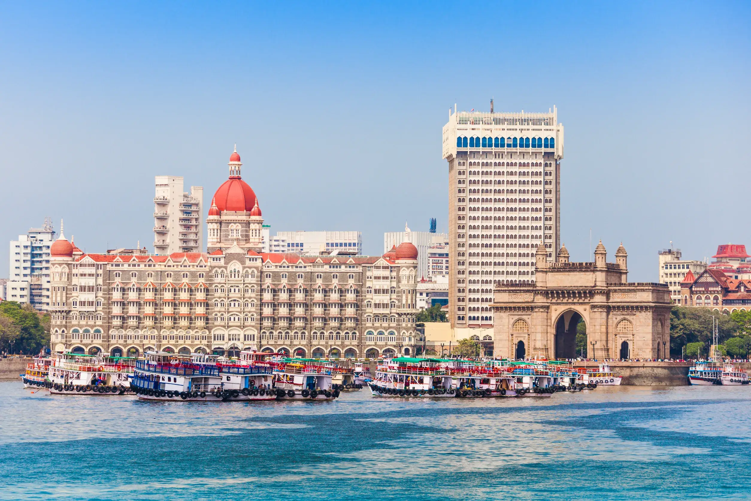 gateway of india and boats as seen from the mumbai harbour in mumbai india