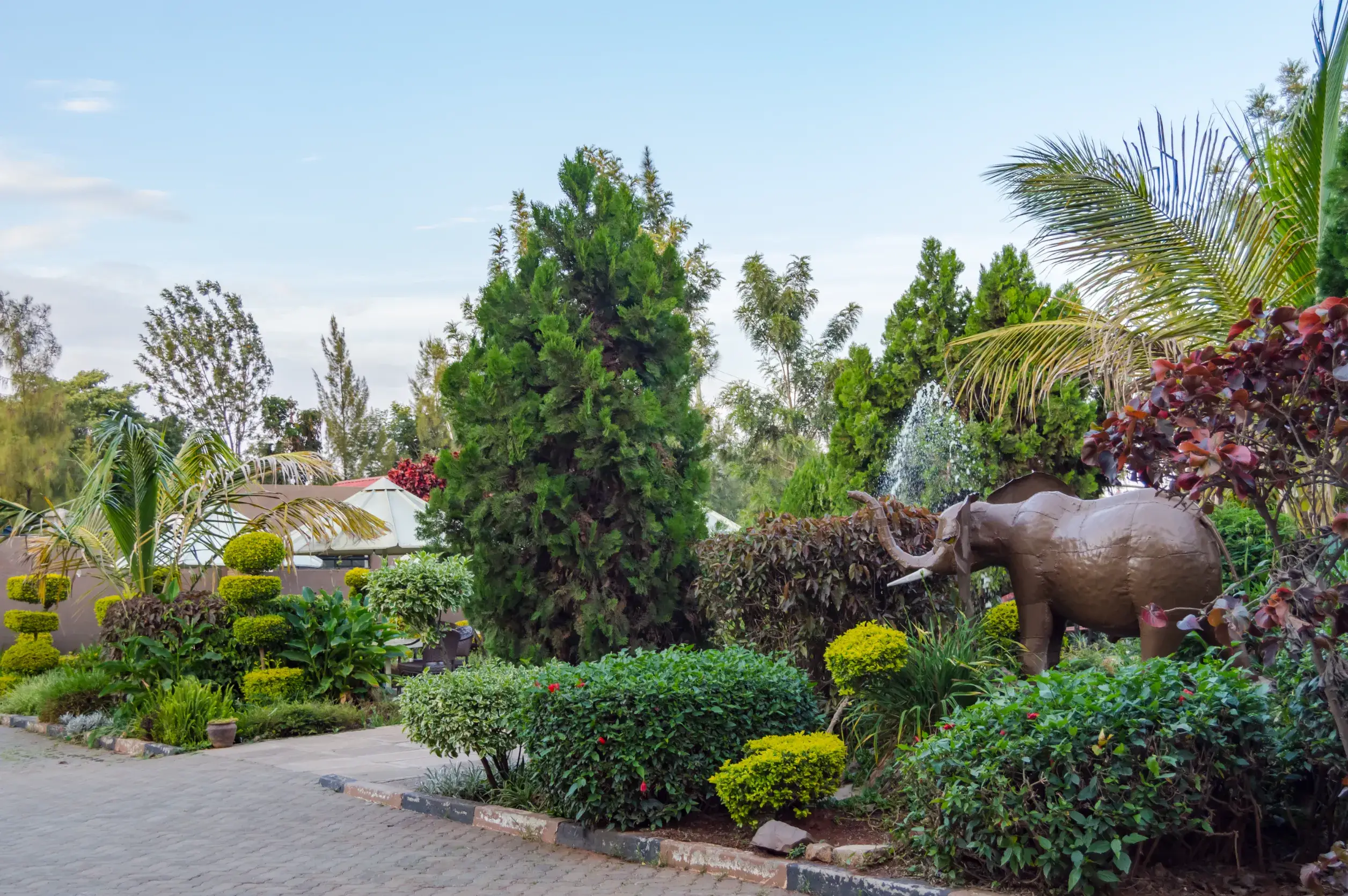 water spray and umbrella and an elephant statue in nairobi city